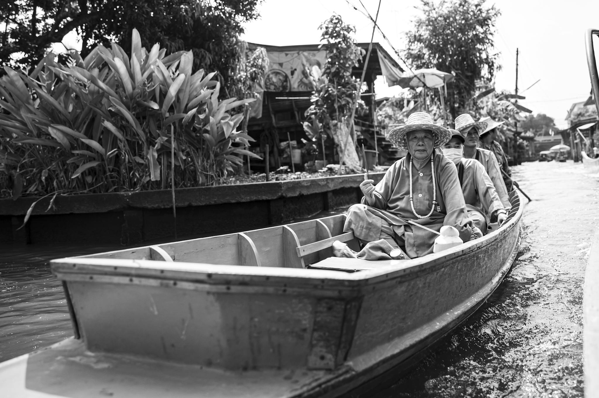 Explore the vibrant culture on a traditional boat ride through Southeast Asia's bustling waterways.